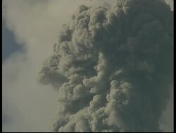 MS grey smoke and ash cloud billow from crater into sky, zoom in to CU, Mount Tunguragua, Ecuador Stock Footage