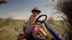 GENDER NEUTRAL KIDS. A Happy Little Girl Drive Go-chart, Off-Road. Happy Memories Of Her Young Days Stock Footage
