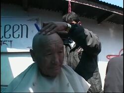 Buddhist monks pray for those killed in clashes in Lhasa in March News Clip