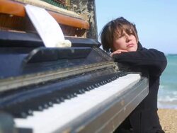 thoughtful young woman and an old piano Stock Footage