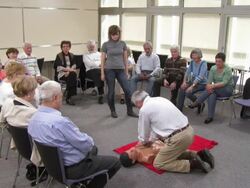 HD: Senior Man Practicing CPR On A Dummy Stock Footage