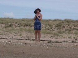 (HD1080i) Beach Yoga: Namaste and Stretching neck Muscles Stock Footage
