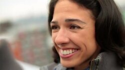Grinning girl kisses boyfriend on Brooklyn rooftop Stock Footage