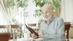 Senior Man Calling A Waiter Stock Footage