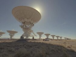 WS ZO Truck pulling solar panel with satellites dishes / San Augustine, New Mexico, USA  Stock Footage