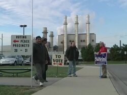 November 2, 2010 PAN Campaign workers standing near posted signs directing voters to the entrance / Dearborn, Michigan, United States Stock Footage