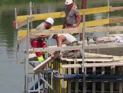 MS Shot of workmen working for construction of new bridge at Moselle river / Wellen, Rhineland Palatinate, Germany Stock Footage