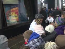 Shasha Cohen (2006 Olympic silver medalist), Lara Spencer & Ginger Zee (GMAâ€™s weather anchor) wearing roller blade helmets pose with Josh Elliott on the outside set of the Good Morning America show Stock Footage