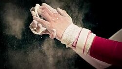 SLO MO Female gymnast clapping wrapped hands together Stock Footage