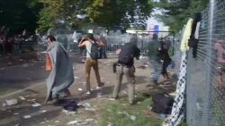 Refugees at Hungary/Serbia Border Sprayed with Water Cannon News Clip