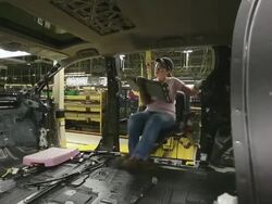 MS PAN Worker using an ergonomically designed sled to help her moving inside mini van / Princeton, Indiana, United States Stock Footage