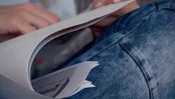 Graphic designer working at home, looking at blueprints Stock Footage