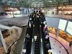 MS T/L Shot of people moving on escalators and shops at Seoul Train Station / Seoul, South Korea Stock Footage
