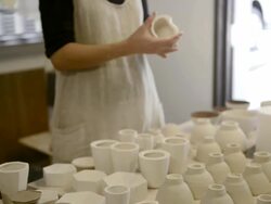 MS TU Shot of female potter confirm wooden bowl in studio / Kyoto, Japan Stock Footage