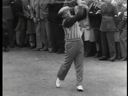 B/W 1944 Bing Crosby teeing off in golf competition raising funds for War Bonds / crowd in background / doc. Stock Footage