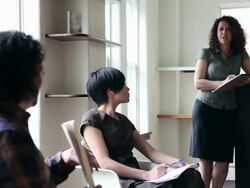 PAN MS R/F three coworkers in discussion in office/Seattle, Washington, USA Stock Footage