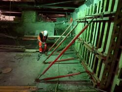 Long shot of worker drilling in Crossrail tunnel. Stock Footage