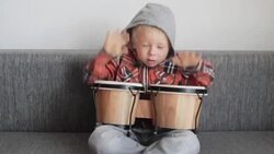Happy boy with bongos Stock Footage