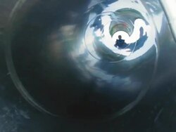 Boy sliding down the tube slide Stock Footage
