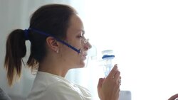 portrait of  young woman doing inhalation at home Stock Footage