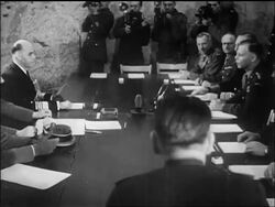 B/W May 1945 Nazi + Allied officers sitting at signing of Germany's surrender / newsreel Stock Footage
