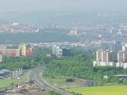 WS AERIAL ZO View of city skyline with traffic on roads / Prague, Czech Republic Stock Footage