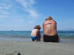 HD: Mother and baby playing at beach Stock Footage