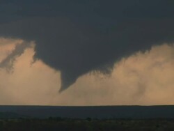 WS View of cone tornado tracking across ridge / Turkey, Texas, United States Stock Footage