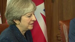 Theresa May and Justin Trudeau shake hands News Clip