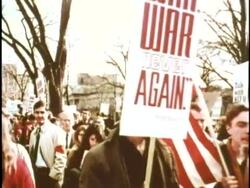 U.S. civilians raise anti-war signs during a demonstration in Washington , D.C. News Clip