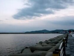 WS T/L View of breakwaters and lighthouse in the port of Goseong from sunset until night / Goseong, Gangwondo, South Korea  Stock Footage