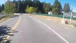 A rural road on San Juan Island near Lime Kiln State Park on a warm sunny day. Stock Footage