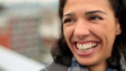 Young woman in love laughs at boyfriend on Brooklyn rooftop Stock Footage