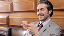 Lawyer using cell phone in courtroom Stock Footage