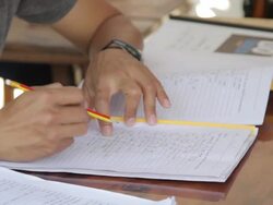 Male Writing An Assignment Stock Footage