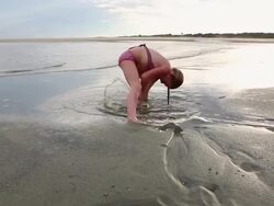 MS TU Shot of young girl playing in sand at beach / St. Simons Island, Georgia, United States Stock Footage