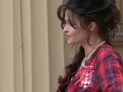 Helena Bonham Carter Poses with CBE at the Palace News Clip
