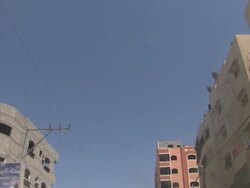 Driving shot through Gaza city past Hamas mural News Clip