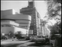 B/W 1959 Guggenheim Museum with traffic on street in foreground / NYC / newsreel Stock Footage