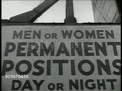 1944: UNEMPLOYED WANTED: WS City street, traffic, pedestrians. VS Help wanted signs 'Men or Women...' 'wanted Freight Handlers...' CU Newspaper classified want ads. WS City street intersection. Unemployment, employment, jobs, layoffs. USA Instructional Video