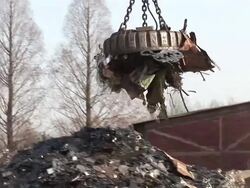 MS POV Magnet lifting steel scrap at scrapyard / Bous, Saarland, Germany Stock Footage