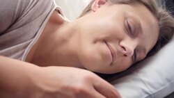 People waking up - Young woman opens her eyes on a sunny morning Stock Footage