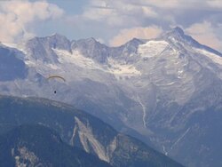 HD Paraglider in front of high mountain range Stock Footage