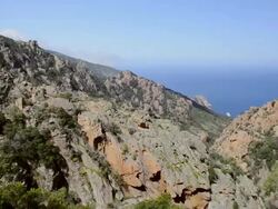 WS PAN HA View over mountains of Calanche of Piana to sea, UNESCO World Heritage Site / Porto, Corsica, France Stock Footage