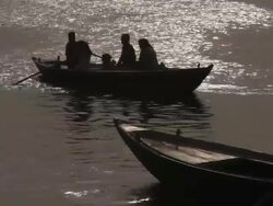 WS Men rowing boats on Ganges River / Varanasi, India Stock Footage