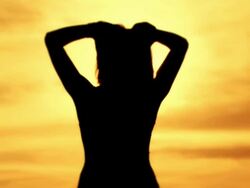 Woman silhouette at sunset Stock Footage