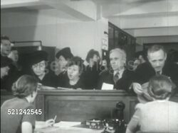 MOT 1933: NEW YORK, NEW YORK: REFUGEES: VS BEHIND Clerks behind counter crowded w/ people, men, women, woman holding child. NEW SCHOOL for SOCIAL RESEARCH: VS Members of the 'University in Exile' meeting w/ sponsored faculty of German & Jewish immigrant Instructional Video