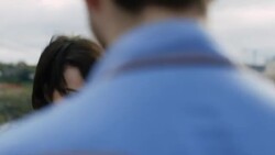 Cute young woman dances with boyfriend on rooftop overlooking Austin, Texas skyline Stock Footage