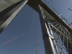 Low Angle static - A prison gate opens automatically. / California, USA Stock Footage