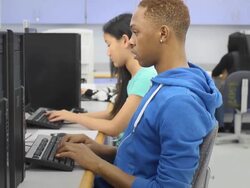 Male Student Works on Computer in Classroom Stock Footage